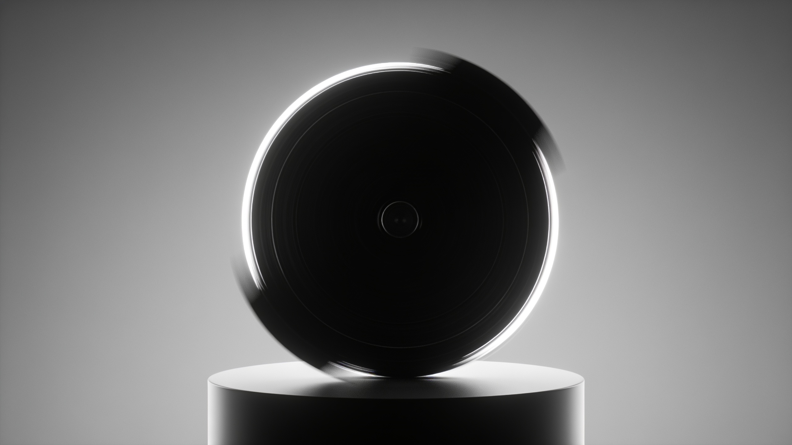 Looping B-roll: rotating product on pedestal with studio rim light