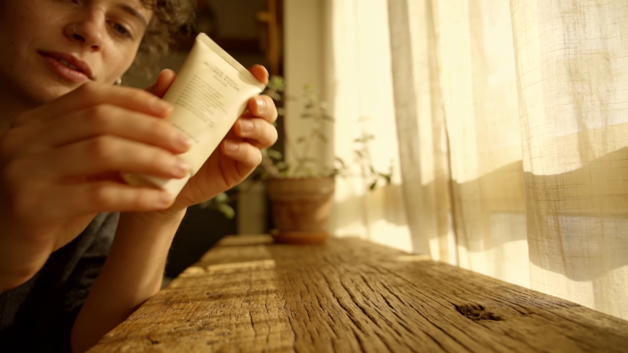 Lifestyle holding shot with natural window light.