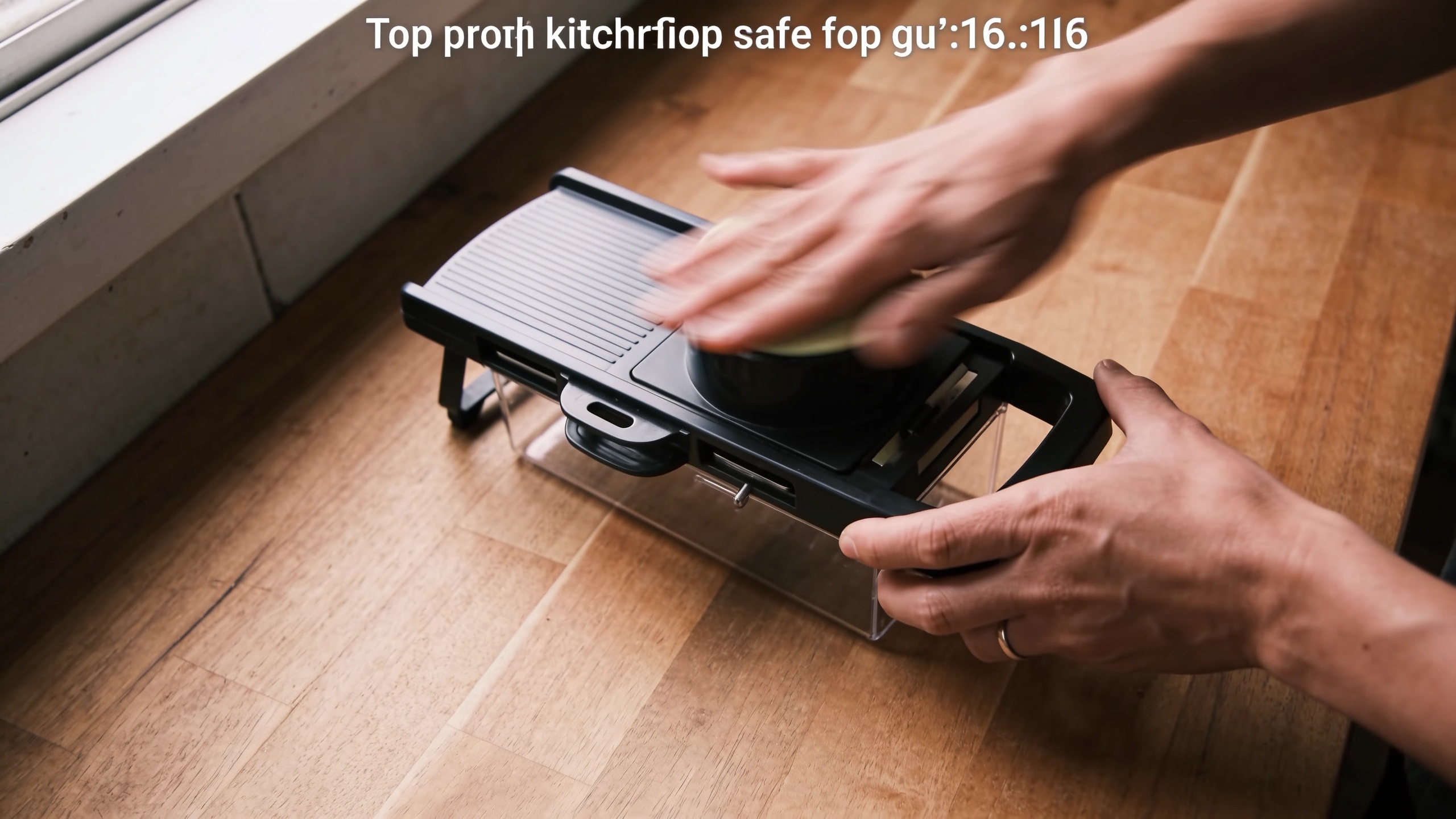 Top-down demo of a kitchen gadget being used on a wooden counter