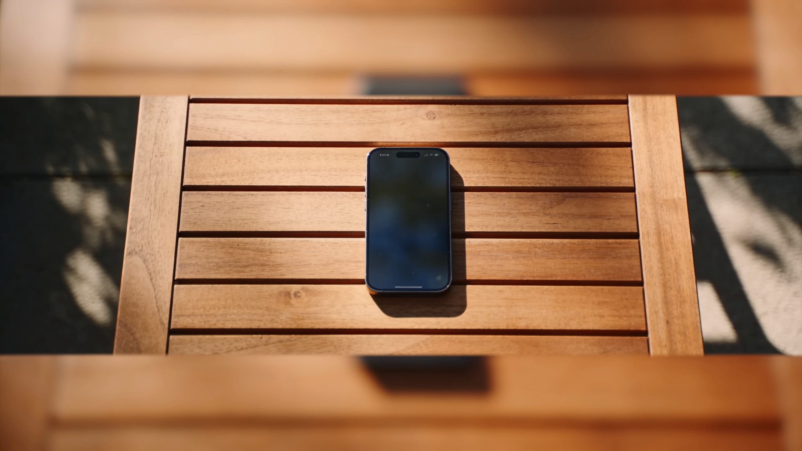 Vertical overhead smartphone on table with soft sunlight and parallax motion